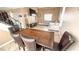 Living room and dining room area with tile floors and neutral paint scheme at 2722 Sweet Basil Dr, Las Vegas, NV 89142