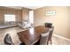 Open living area featuring a dining table, couch and stairs with natural light at 2722 Sweet Basil Dr, Las Vegas, NV 89142