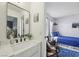 Bright bathroom featuring a stylish black framed mirror and a modern farmhouse style vanity at 2809 Du Barry Manor Ln, Las Vegas, NV 89108