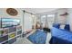 Bright bedroom with barn door to ensuite bath; features a large area rug at 2809 Du Barry Manor Ln, Las Vegas, NV 89108