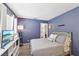Comfortable bedroom showcasing a cozy bed, TV, and stylish decor at 2809 Du Barry Manor Ln, Las Vegas, NV 89108