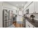 Bright kitchen features stainless steel appliances, white cabinetry, and granite countertops at 2809 Du Barry Manor Ln, Las Vegas, NV 89108