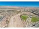 An aerial view showcasing the community's park, baseball field and neighborhood at 3240 Avernus Ave, Henderson, NV 89044