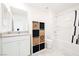 Well-lit bathroom featuring a tub, storage, and modern fixtures at 3240 Avernus Ave, Henderson, NV 89044