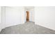 Bright bedroom featuring gray carpet, a closet, and fresh white paint at 3240 Avernus Ave, Henderson, NV 89044
