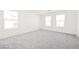 Bright bedroom with plush carpeting and multiple windows allowing for natural light at 3240 Avernus Ave, Henderson, NV 89044