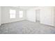 Well-lit bedroom with soft carpeting and a walk-in closet at 3240 Avernus Ave, Henderson, NV 89044