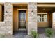 Close-up of home's entrance with stone accents and address number at 3240 Avernus Ave, Henderson, NV 89044