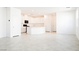 Expansive open-concept area features tile floors, white cabinetry, and natural light at 3240 Avernus Ave, Henderson, NV 89044