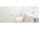 This half-bathroom features a pedestal sink, toilet and modern fixtures at 3240 Avernus Ave, Henderson, NV 89044