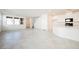 Bright, open-concept living space with tile flooring and large windows at 3240 Avernus Ave, Henderson, NV 89044