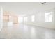 Bright living room featuring tile flooring and large windows providing ample natural light at 3240 Avernus Ave, Henderson, NV 89044
