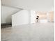 Open floor plan showcasing the living room and modern kitchen with white cabinets and stainless-steel appliances at 3240 Avernus Ave, Henderson, NV 89044