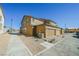 Rear view of townhome with attached garages and low-maintenance landscaping at 3240 Avernus Ave, Henderson, NV 89044