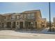 Exterior view of a row of well-maintained two-story townhomes at 3240 Avernus Ave, Henderson, NV 89044