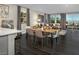 Bright, open-concept dining area with a sleek table and chairs, connecting to a cozy living space at 3426 Oristano Ln, Henderson, NV 89044