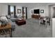 Comfortable game room featuring a plush sectional sofa and entertainment area with a TV and game table at 3426 Oristano Ln, Henderson, NV 89044