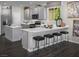 Modern kitchen with white countertops, stainless steel appliances, and a breakfast bar with seating at 3426 Oristano Ln, Henderson, NV 89044