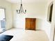 Dining room featuring tile floors, chandelier, and a large window for natural light at 3936 Pepper Thorn Ave # 102, North Las Vegas, NV 89081
