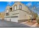 Beige stucco two-story condo with garage parking and minimal landscaping at 3936 Pepper Thorn Ave # 102, North Las Vegas, NV 89081