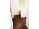 Upstairs hallway with wood floors, white walls, and storage cabinet at 3936 Pepper Thorn Ave # 102, North Las Vegas, NV 89081