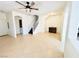 Bright living room featuring tile flooring, staircase and ceiling fan at 3936 Pepper Thorn Ave # 102, North Las Vegas, NV 89081