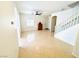Bright living area with tile floors, staircase, ceiling fan and natural light at 3936 Pepper Thorn Ave # 102, North Las Vegas, NV 89081