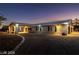 Charming single story home with a brick exterior, covered porch and well manicured lawn and mature landscaping at 3950 Oakridge Ave, Pahrump, NV 89048