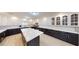 Spacious kitchen featuring an island, stainless steel appliances, granite countertops, and white cabinets at 3950 Oakridge Ave, Pahrump, NV 89048