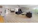 Large open concept living room with hardwood floors, modern furnishings, and neutral paint throughout at 3950 Oakridge Ave, Pahrump, NV 89048