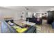 Open concept living room with hardwood floors, modern furnishings, and neutral paint at 3950 Oakridge Ave, Pahrump, NV 89048