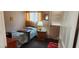 Simple bedroom with a bed, side table, and window at 4119 Meadowglen Cir, Las Vegas, NV 89121