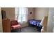 Modest bedroom with a single bed, window, and dresser at 4119 Meadowglen Cir, Las Vegas, NV 89121