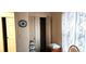 This bedroom features a neutral color scheme, a closet, and a wall clock at 4119 Meadowglen Cir, Las Vegas, NV 89121
