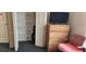 Organized closet space with shelving and storage solutions, complemented by nearby furniture at 4119 Meadowglen Cir, Las Vegas, NV 89121