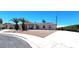 Charming single-story home featuring solar panels, desert landscaping, and a spacious curved driveway at 4119 Meadowglen Cir, Las Vegas, NV 89121