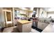A kitchen with a central wooden island, tile flooring, and stainless steel appliances at 4119 Meadowglen Cir, Las Vegas, NV 89121