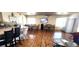 Spacious living area with wood floors, an open layout, and a full kitchen and dining area at 4119 Meadowglen Cir, Las Vegas, NV 89121