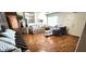 Inviting living room with wood floors, neutral tones, and comfortable seating arrangements at 4119 Meadowglen Cir, Las Vegas, NV 89121