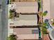 Aerial view of several homes with desert landscaping, backyards, driveways, and roof tops at 4124 Gliding Gulls Ave, North Las Vegas, NV 89084