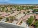 A scenic aerial view of homes in the neighborhood with desert landscaping and mountain views in the distance at 4124 Gliding Gulls Ave, North Las Vegas, NV 89084