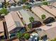 A high angle aerial shot of the home with a landscaped yard, two car driveway, and desert landscaping at 4124 Gliding Gulls Ave, North Las Vegas, NV 89084