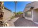 Well-maintained backyard, featuring a mix of greenery and rock landscaping, offering a private outdoor oasis at 4124 Gliding Gulls Ave, North Las Vegas, NV 89084