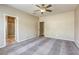 Cozy bedroom featuring neutral carpet and ensuite bathroom at 4124 Gliding Gulls Ave, North Las Vegas, NV 89084