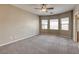 Spacious bedroom features a ceiling fan, plush carpet, and a bay window at 4124 Gliding Gulls Ave, North Las Vegas, NV 89084