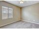 Bright bedroom features a ceiling fan and a large window, providing comfortable climate control and natural light at 4124 Gliding Gulls Ave, North Las Vegas, NV 89084