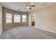 Large bedroom with a ceiling fan, neutral carpet, and bay window at 4124 Gliding Gulls Ave, North Las Vegas, NV 89084