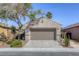 Inviting single Gathering home features a well-maintained desert landscape, two car garage, and cozy curb appeal at 4124 Gliding Gulls Ave, North Las Vegas, NV 89084