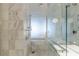 Walk-in shower, modern showerhead, and tile in this modern bathroom create a spa-like experience at 4381 W Flamingo Rd # 3818, Las Vegas, NV 89103