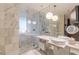 Contemporary bathroom features a glass shower, marble countertops, modern fixtures, and a soaking tub at 4381 W Flamingo Rd # 3818, Las Vegas, NV 89103